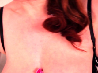 Redhead MILF Red XXX offers her pussy a massage