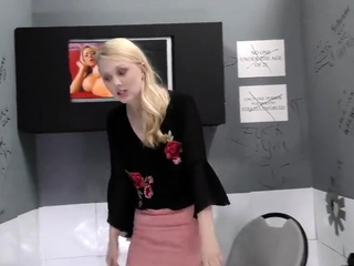 Young blonde slobbers on a huge BBC in a gloryhole