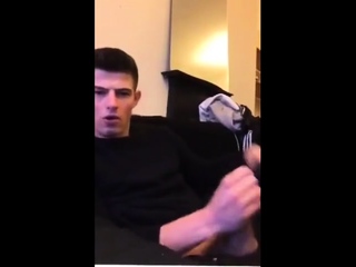 Cute guy jerks his large cock off