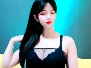 Asian babe sucking and jerking two really hard dicks