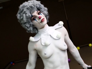 A clown dressed babe teasing newbie type