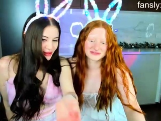 Blonde and brunette lesbians munch their asses