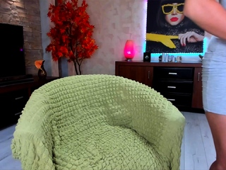 Busty curly brunette with huge boobs fucks on sofa