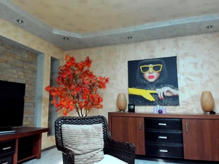 Busty curly brunette with huge boobs fucks on sofa